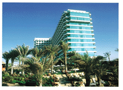 Hilton Dubai, beautiful gardens leading onto white soft sandy beach.